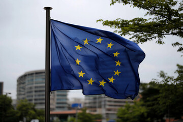 European Union flag waving in urban setting