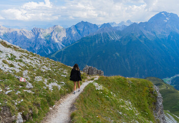 Young girl in black jacket summit to Alps, Austria, Tyrol