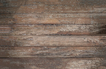 Fototapeta premium The background texture of a worn old wooden background