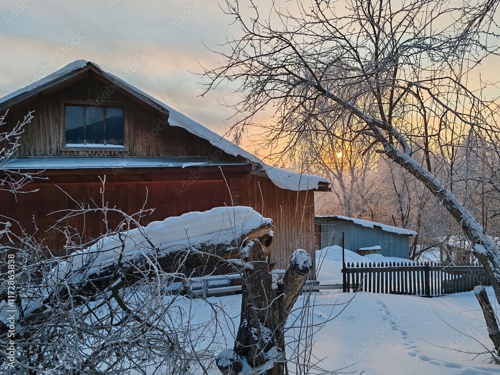 Poster a house with a snow covered roof and a fence in front of it