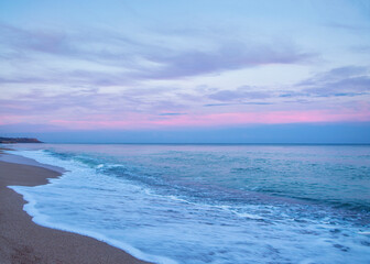 calm seascape at dawn, sunset. long exposure., pale tones of waves and clouds