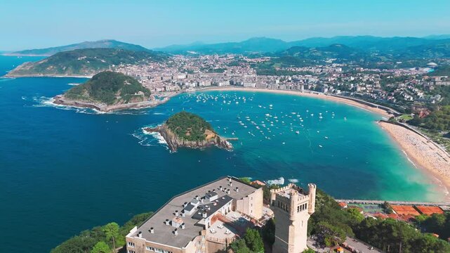 Flying over monte Igueldo Tower in San Sebastian city, Basque country, Spain