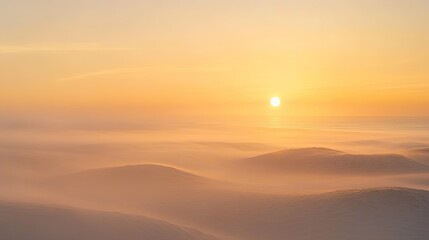 Obraz premium Sunrise over fog-covered hills.