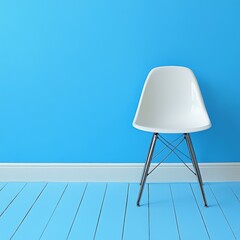 A minimalist white chair against a bright blue wall and floor, showcasing modern design.
