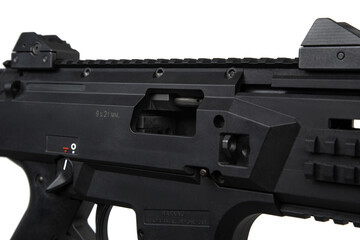 A modern black PCC (Pistol Caliber Carbine) with a suppressor, tactical rails, and adjustable...