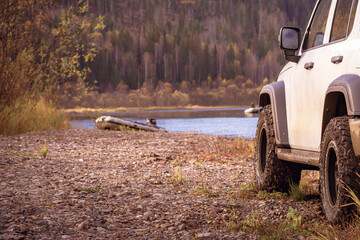 Off-road car trip to the lake, lake background. Fishing and outdoor recreation background. © Vladimir Razgulyaev