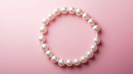 Obraz premium Pearl necklace arranged in a circle, soft pink backdrop