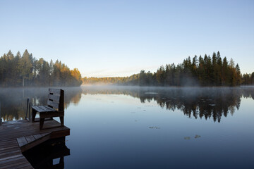 Foggy mornign by the lake in fall