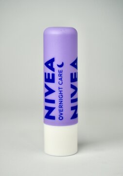 Jakarta, Indonesia - January 3rd, 2025 - Nivea brand lip balm object with pretty purple packaging isolated on vertical white background.