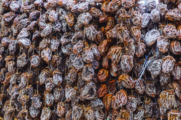 Dried persimmon fruits are sold at the market. dried fruits.