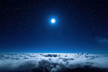Moon shining above a sea of clouds with a stunning starry sky at night
