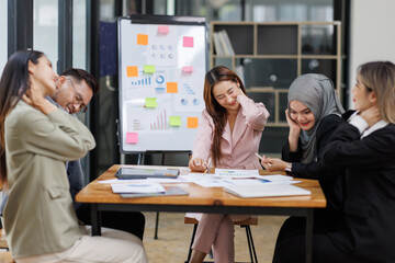 Business Asian people, laptop and conversation with research, teamwork and connection in the office. Group, employees and accounting with computer, internet and cooperation with meeting and planning