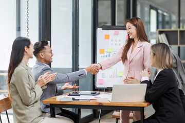 Business Asian people, laptop and conversation with research, teamwork and connection in the office. Group, employees and accounting with computer, internet and cooperation with meeting and planning