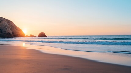 Fototapeta premium a beach with a rock formation in the background