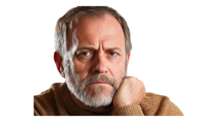 Thoughtful man with a beard resting his chin on his hand, reflecting in a casual setting, indoors.