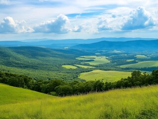 a mountain landscape with a blue sky and a valley, a vibrant and natural outdoor view with open fields.
