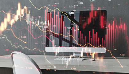 Financial graph overlay on office desk with declining red chart and data visualization, symbolizing market downturn or economic crisis.