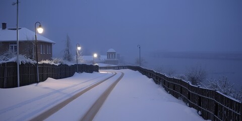 Snow Covered Road at Dusk Winter Scene with Streetlights and Fence