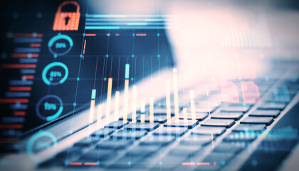 Financial graphs and charts overlaying a keyboard in a digital interface concept.