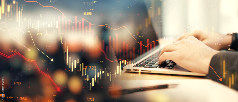 Poster financial data charts overlaying hands typing on a laptop on a blurry office background representing
