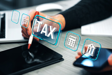 Fototapeta premium Digital interface with tax icons on a modern business desk background.