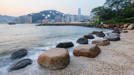Fototapeta premium Serene Hong Kong Seascape: City Skyline and Coastal Rocks