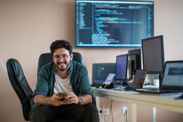 A programmer diligently testing smartphone applications 