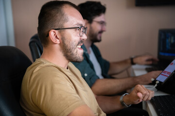 Programmers engrossed in deep collaboration, diligently working together to solve complex problems...