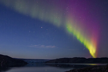 Northern lights in the glacier of Qaleraliq (South Greenland)	
