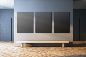 Modern gallery interior with blank black canvases on a wall and a wooden bench below, featuring contemporary minimalistic design. 3D Rendering