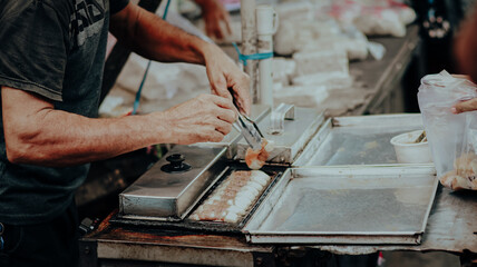 Close-up of process making pukis cake, Pukis is made of a wheat flour-based batter and cooked in a special mold pan, “pukis” a traditional Asian Indonesian cake 