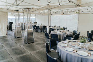 Round tables set up at the celebration venue