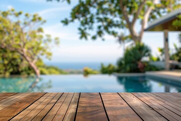 Relaxing view of a wooden deck overlooking a tranquil pool and lush greenery. Perfect for summer vibes.