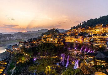Beautiful landscape at the Furong old Town with lighting waterfall, The famous tourist destination...