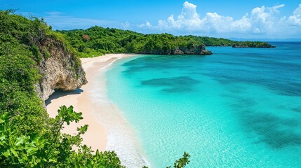 Stunning aerial view of a pristine beach surrounded by lush greenery and crystal-clear waters on a sunny day in a tropical paradise