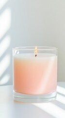 Close-up of a lit white candle in a glass jar, casting soft natural shadows, perfect for themes of relaxation, self-care, and minimalism.