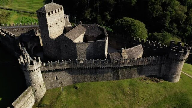 Bellinzone, Switzerland: Aerial drone footage of Bellinzona ancient medieval Montebello castle in Canton Ticino in Switzerland. Shot with an orbit and downward motion