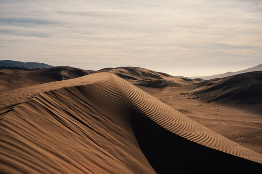 Large sand dunes in a desert landscape, Chile