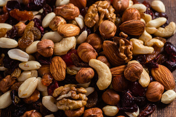 Mixture of nuts and dried fruits close-up.
