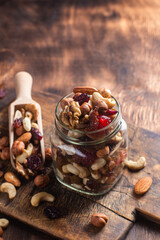 Mixture of nuts and dried fruits close-up.