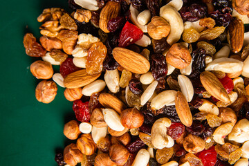 Mixture of nuts and dried fruits close-up.