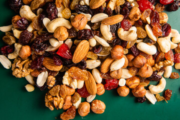 Mixture of nuts and dried fruits close-up.