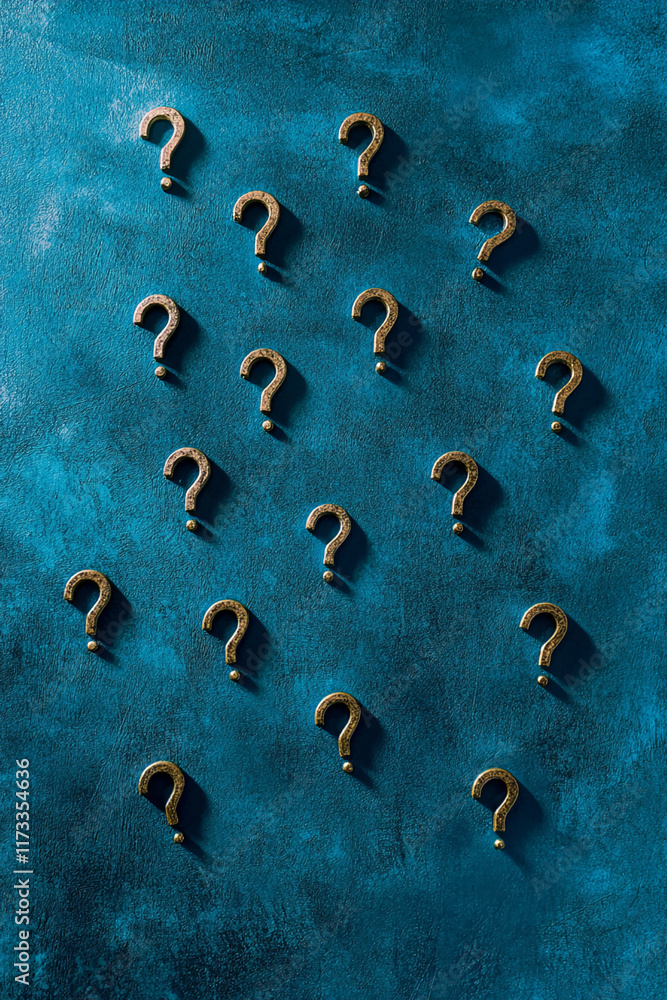Poster Multiple golden question marks on textured blue background with dramatic shadows