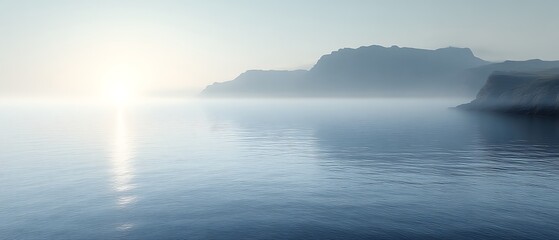 Obraz premium Serene sunrise over misty ocean and mountains.