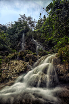 Sri Gethuk Waterfall flowing into Oyo River, Gunung Kidul Regency, Yogyakarta, Indonesia