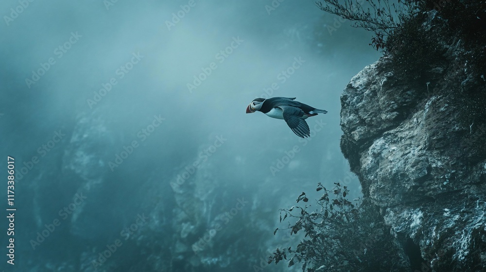 Poster a puffin in flight between dramatic cliffs, misty ocean backdrop.