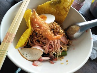 Noddle with fried shrimp and boiled egg