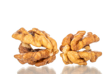 Shelled walnuts, close-up, isolated on a white background.
