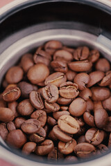 Close View Of Roasted Coffee Beans In Grinder.