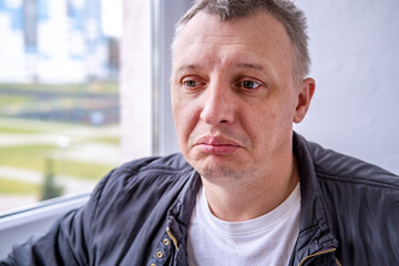 distorted face of sad and grieved very upset person, dissatisfied with his hard fate